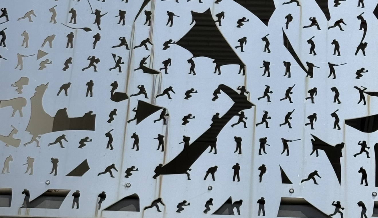 Perforated stainless-steel facade panel at CACTI Park before StratoClean treatment — visible salt-driven rust and oxidation from coastal exposure