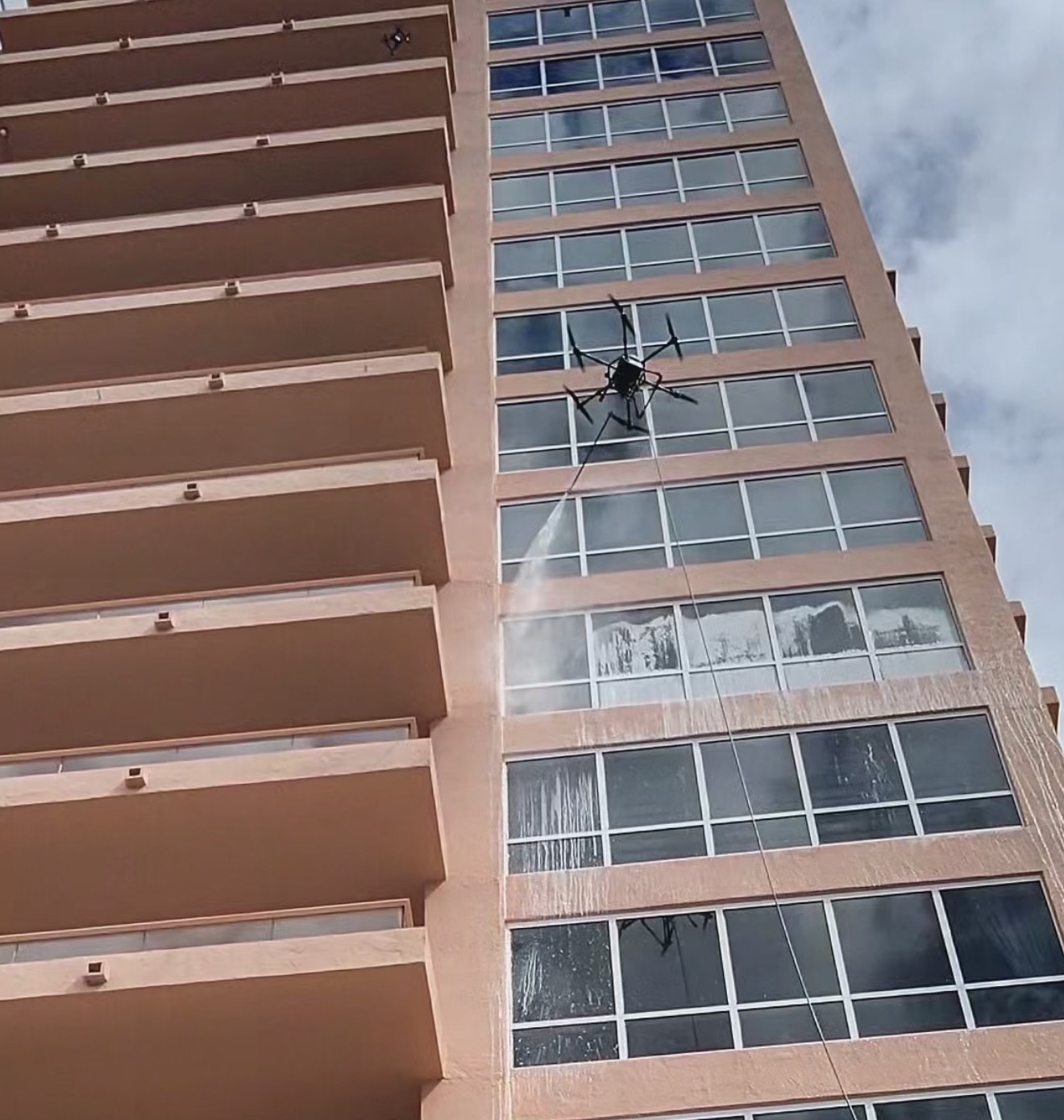 Drone window cleaning at the Gables Club tower in Coral Gables, Miami-Dade