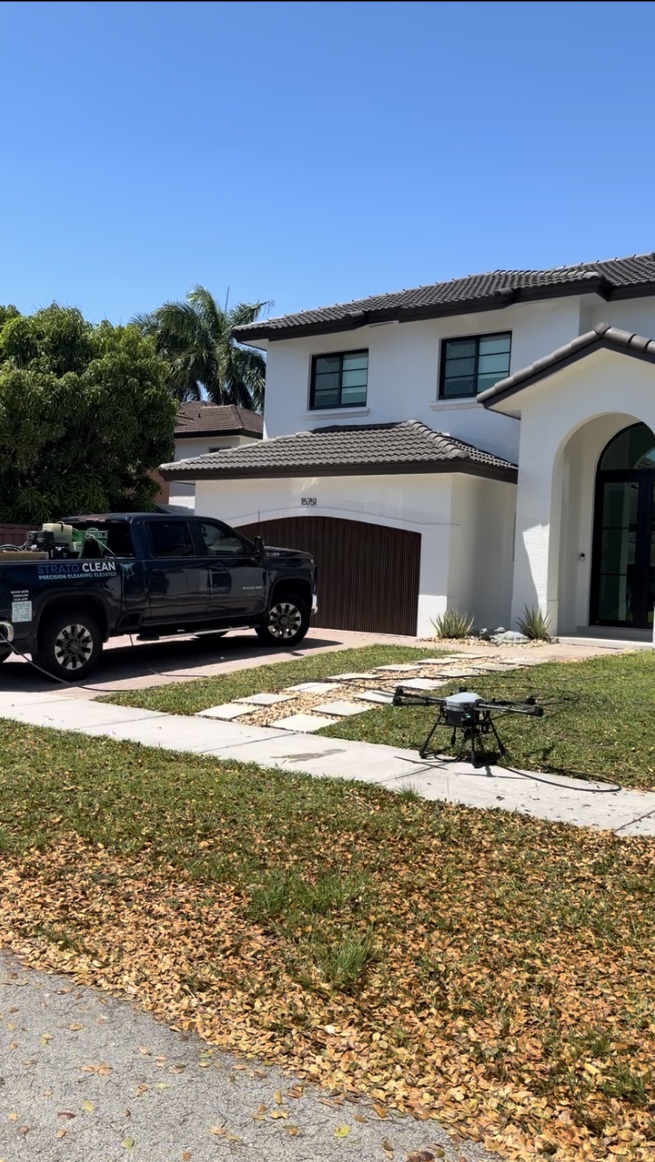 Drone roof cleaning rig preparing to take off at a Kendall, Miami-Dade residence