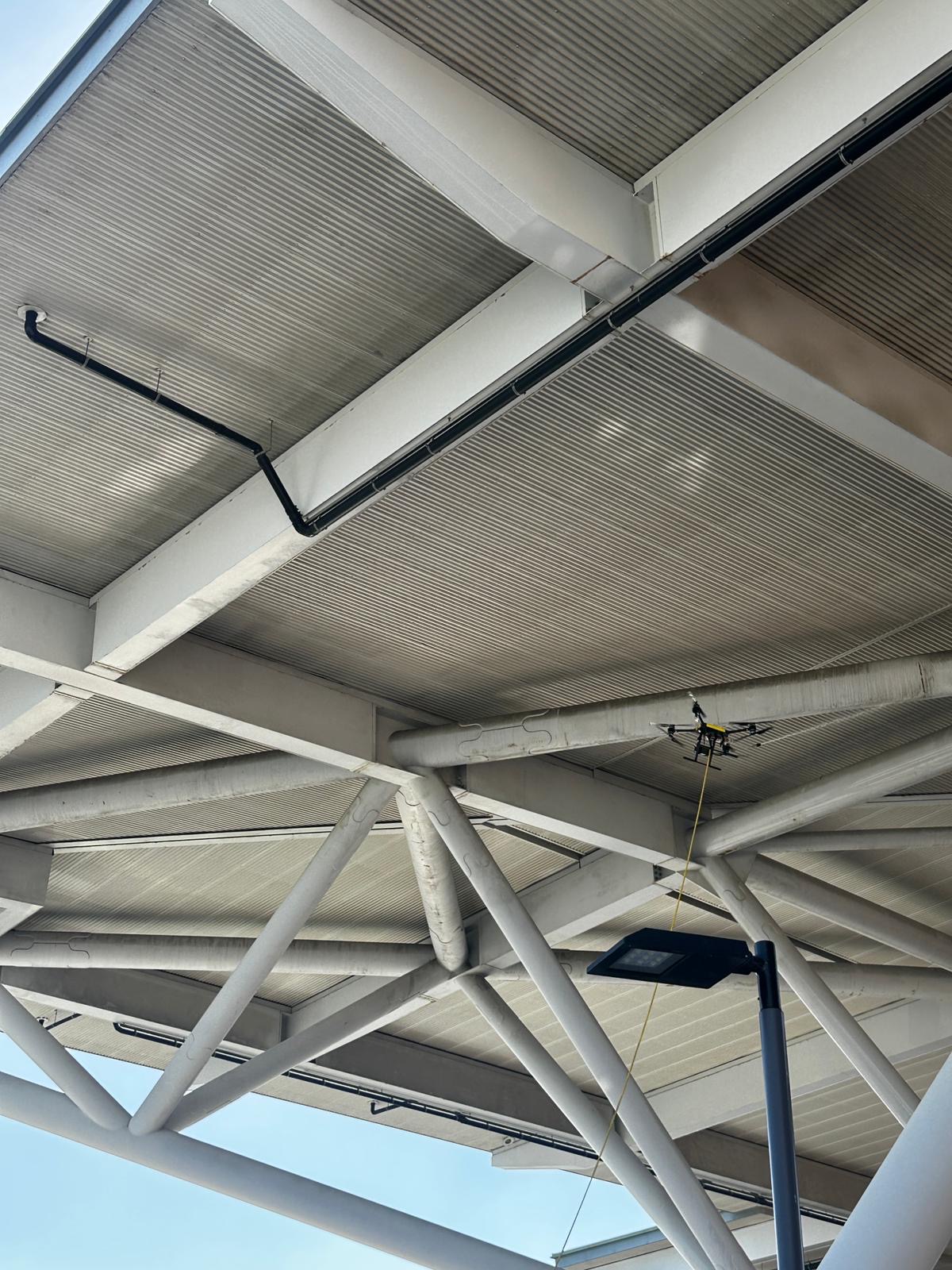 Florida professional stadium facade after StratoClean drone cleaning — stainless restored