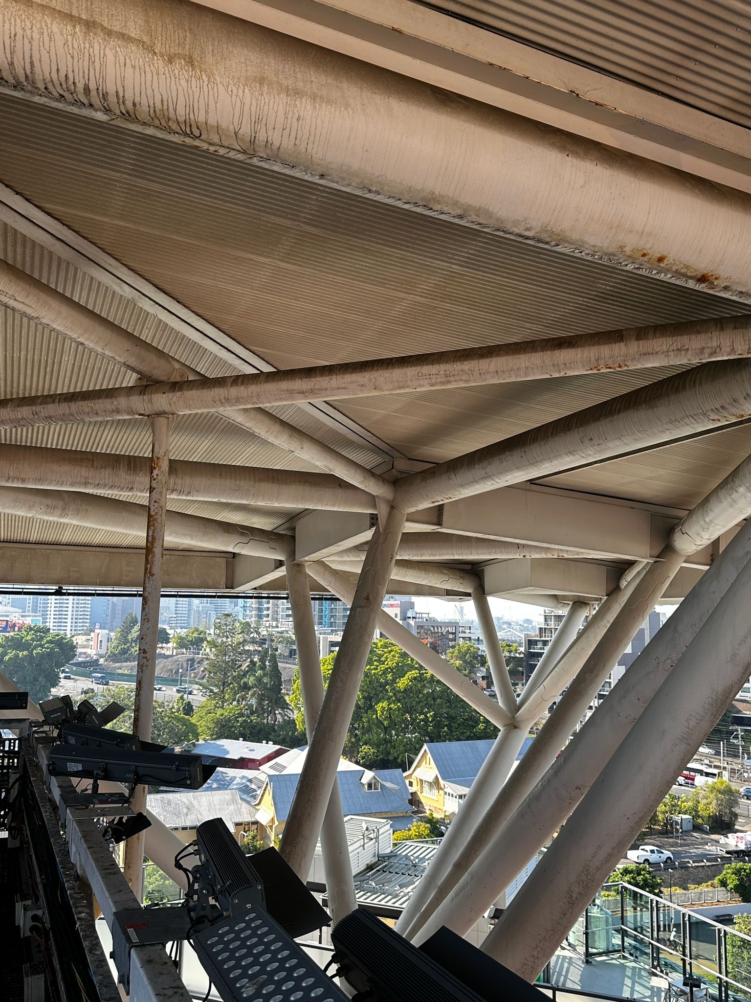 Florida professional stadium facade before StratoClean drone cleaning — salt-driven oxidation